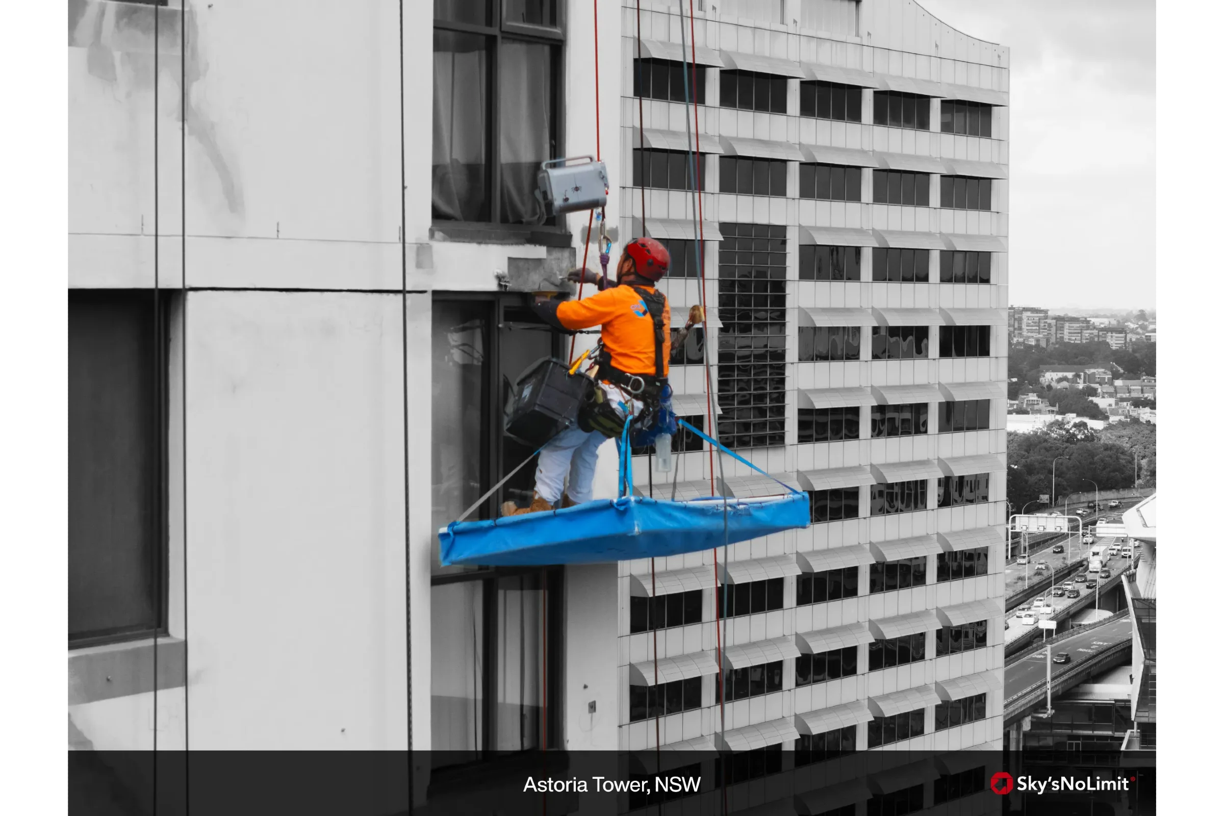 High-rise façade maintenance using a safe access system during a commercial building repair project.